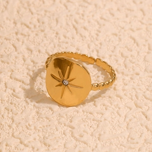 Adjustable 18K gold plated stainless steel ring featuring an eight-pointed star and zircon