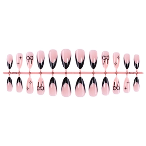 French red almond press-on nails with black bow and star motifs in a full 24pc set