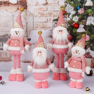 Plush pink and white Christmas standing Santa and snowman figurines for holiday decor