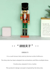 Detail of a 30cm wooden nutcracker with red and green soldier suit holding a gift box