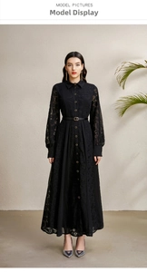 Detail of a black long-sleeve lace patchwork dress with buttons and a slim waist belt