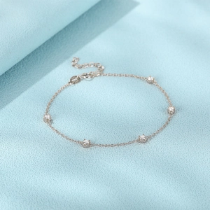 Close-up of S925 sterling silver stamp on minimalist adjustable diamond tennis bracelet