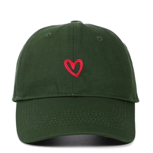 Detailed embroidery of a red heart on a dark green cotton baseball cap
