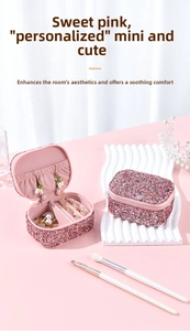 Mini pink glitter jewelry box detail with ring slots and elastic pocket storage