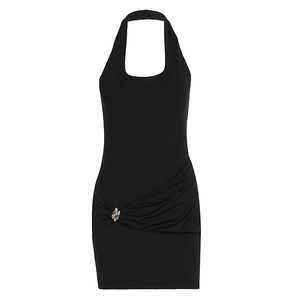 Detail view of black halter mini dress featuring side ruching and metal link hardware
