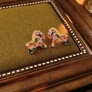 Vintage-style horse-shaped earrings with colorful baguette zircon stones on gold metal base