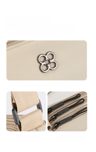 Détails du mini sac bandoulière en nylon avec logo fleur en métal et fermetures éclair