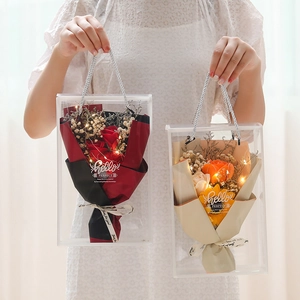 Detailed view of soap rose bouquets with LED lights in transparent gift tote bags