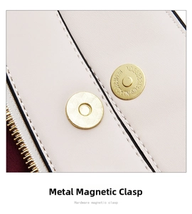 Macro shot of light beige leather bag detail with gold magnetic buckle and fine stitching