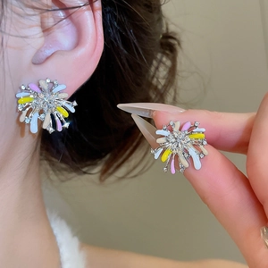 Detail of colorful enamel flower earrings with zircon center inlay for women