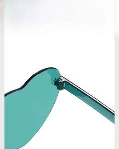 Detail of green heart shaped rimless sunglasses showing a sturdy metal hinge mechanism