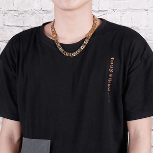 Men's punk style titanium steel king chain necklace in gold and silver finish on model