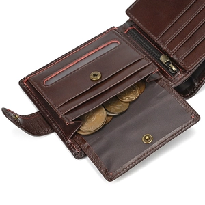 Detail of genuine leather tri-fold wallet with coin pocket and red stitching accents