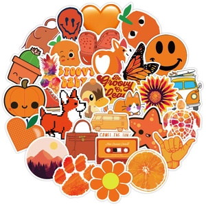 Macro view of orange vinyl stickers with retro groovy patterns and artistic graffiti