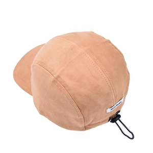 Detail of light brown camp hat showing the adjustable elastic drawstring and brand label