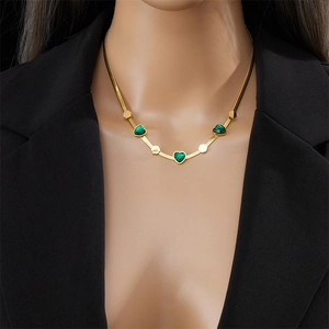 Gold-plated snake chain necklace with green heart gems and hexagonal geometric pendants