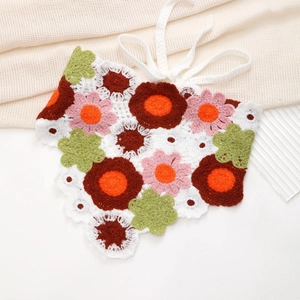 Detailed macro view of handmade colorful crochet floral pattern with cotton knit textures