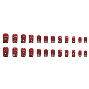 Sparkly burgundy red press-on nails with gold glitter, pearls and metallic wire accents