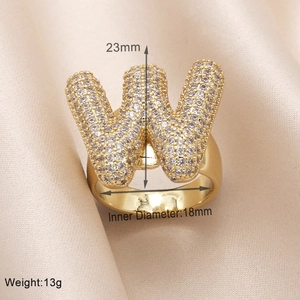 Detail of gold letter W ring with cubic zirconia showing 23mm height and 18mm diameter