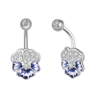 Detail view showing silver navel ring with blue enamel flower and clear zircon stones