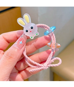 Close-up of a pink elastic hair tie with a cute cartoon rabbit and blue beads for girls