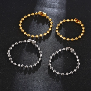 Hip hop titanium steel bead bracelets in gold and silver finish on black background