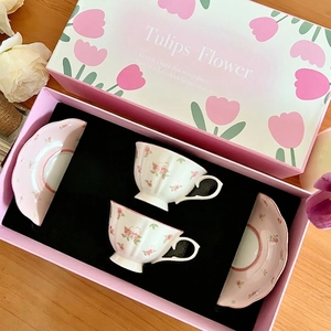 Pink ceramic coffee cup and saucer set with floral rabbit patterns in a gift box