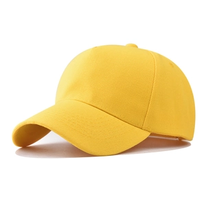 Detailed close-up of a bright yellow five-panel polyester baseball cap with breathable eyelets