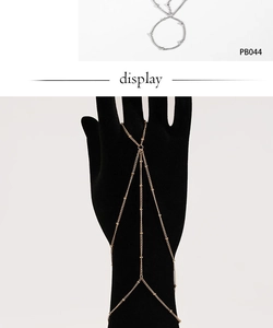 Detailed close-up of gold beaded hand chain with adjustable thin link design PB044