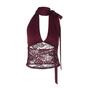 Detailed view of burgundy halter neck vest featuring intricate lace patchwork texture