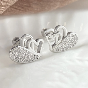 Silver-plated double heart stud earrings with sparkling pavé cubic zirconia accents