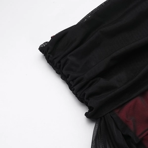 Close-up of ruched mesh fabric texture and pleated detail on the sexy off-shoulder dress