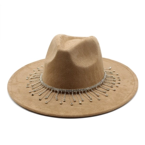 Macro detail of camel wide-brim fedora hat with sparkling rhinestone fringe tassels