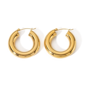 Detail of high-polished golden stainless steel chunky hoop earrings with snap closure