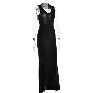 Detail of black V-neck dress with sheer mesh shoulder patch and ruffle hemline
