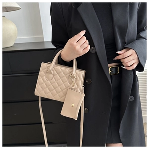 Fashionable beige quilted crossbody bag with a matching mini coin purse shown on a model