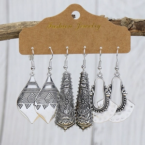 Three-pair set of vintage silver bohemian earrings with geometric and ethnic carved patterns