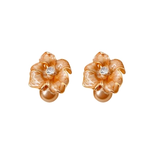 Boucles d'oreilles vintage fleurs orange avec perles champagne et détails dorés sur fond blanc