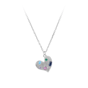 Macro detail of S925 sterling silver heart pendant with vibrant colorful gemstones
