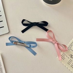 Set of three sweet ribbon bow hair clips in black, light blue and pink colors