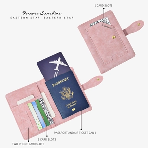 Pink RFID blocking passport holder with 6 card slots and airline ticket compartments