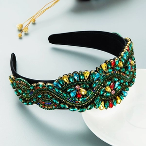 Luxury Baroque headband with colorful rhinestones on black velvet in a side view