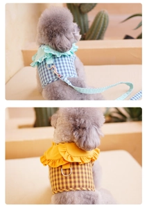 Detail of checkered pet harness with ruffled collar and reinforced metal D-ring buckle