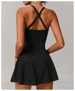 Close-up detail of the cross-back strap design on this black athletic tennis dress