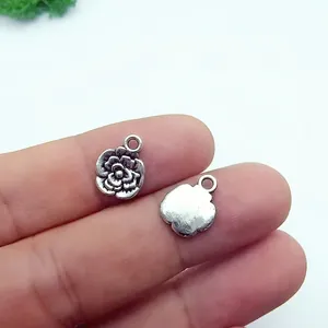 Macro detail of a 13x10mm retro silver alloy rose pendant for DIY jewelry making