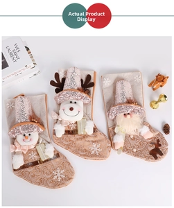 Detail view of sequined Christmas stockings with snowman, reindeer, and Santa embroidery