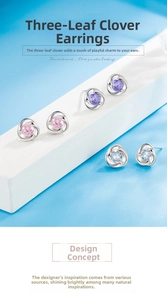 Detailed view of silver clover earrings featuring pink, purple, and light blue zircon stones