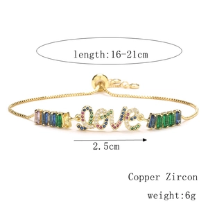 Detail of adjustable gold LOVE bracelet featuring colorful micro-pave zircon stones