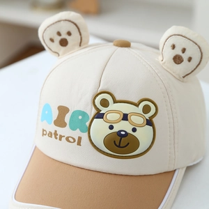 Kids baseball cap featuring bear ears and AIR patrol print in cream and khaki colors