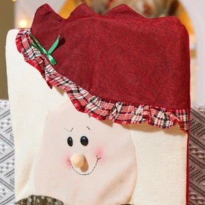 Red Christmas chair cover with cartoon pattern and textured fabric for festive dining decor